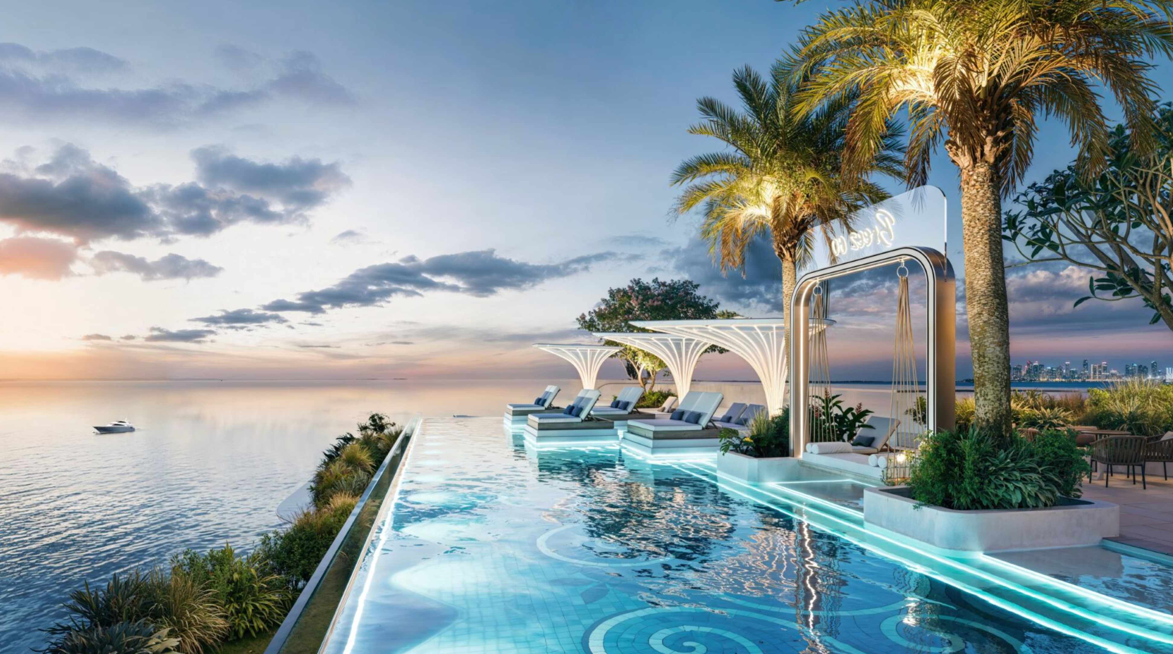 Sunset infinity pool with Dubai skyline views at Breez - luxury waterfront living with panoramic city views